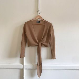 Parallel lines knitted tie front long sleeved top